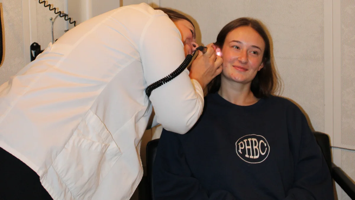 patient having her ears checked