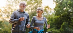 Mature couple taking care of their hearing loss with regular exercising
