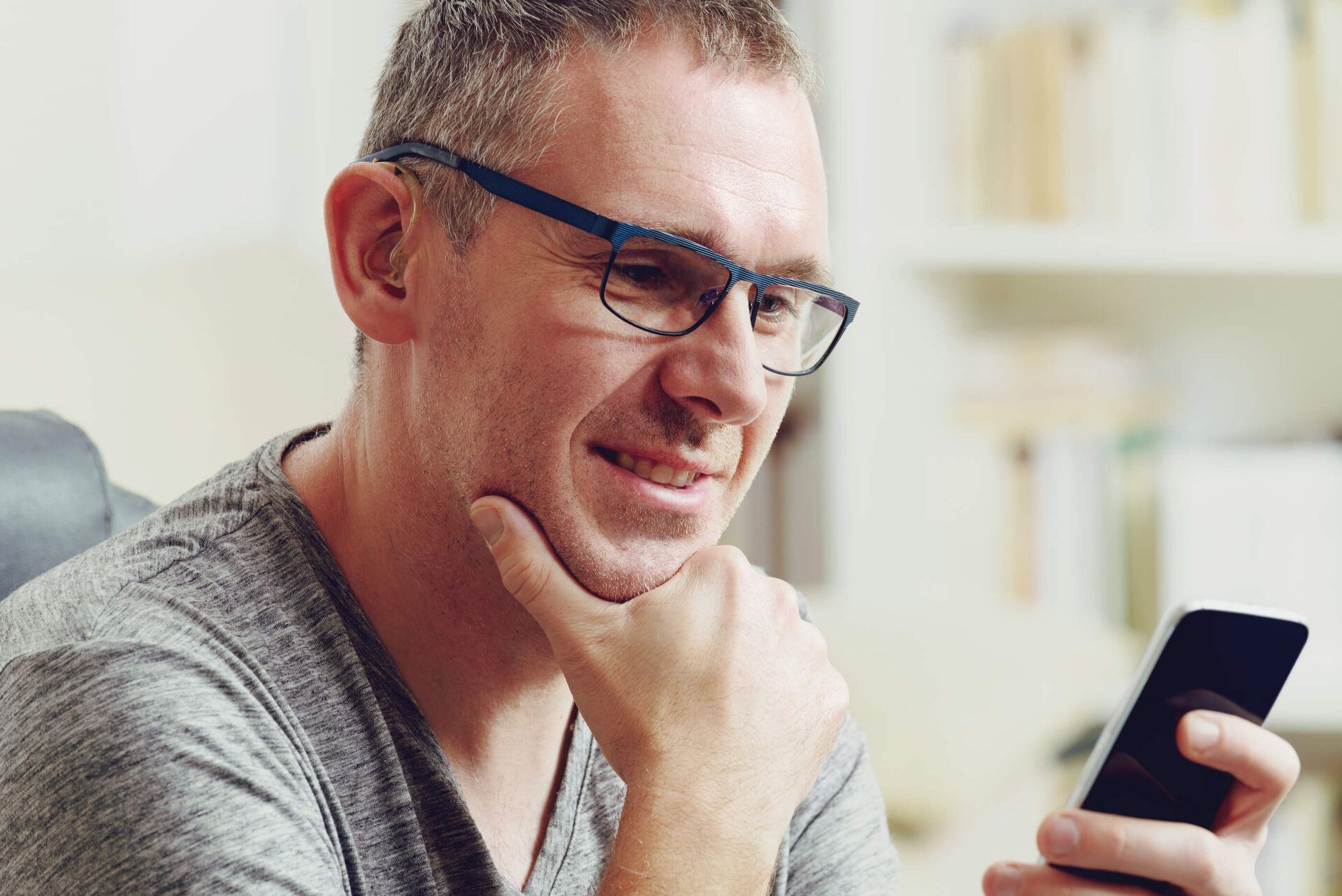 Man Pairing Bluetooth with Hearing Aids